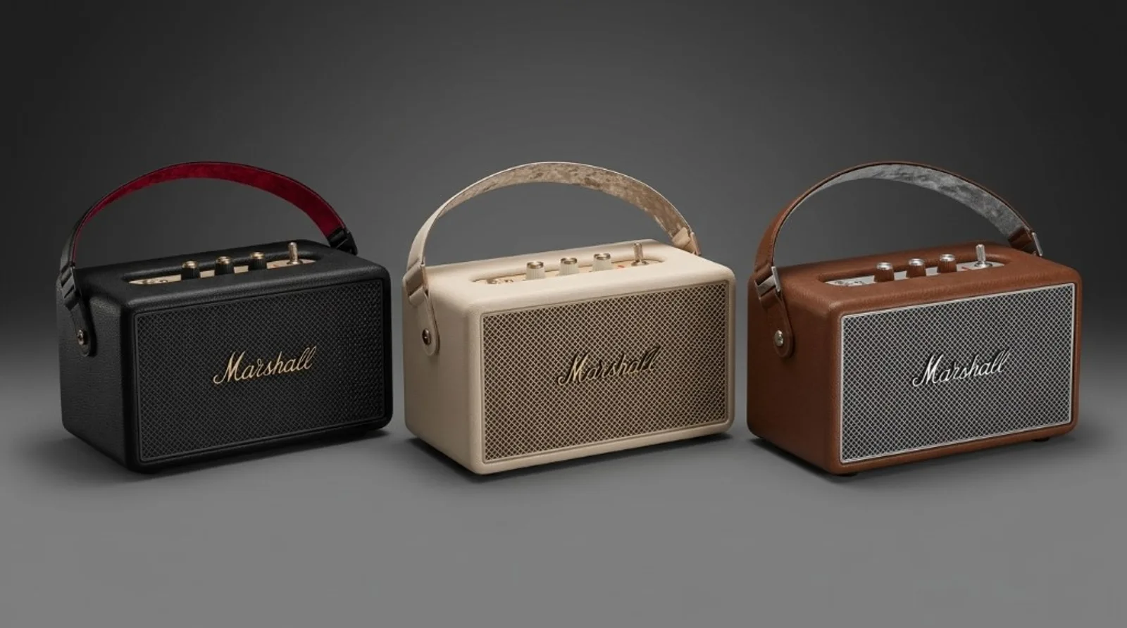 Three Marshall Kilburn III speakers in black, cream, and brown side by side, classic amp design with leather carry strap