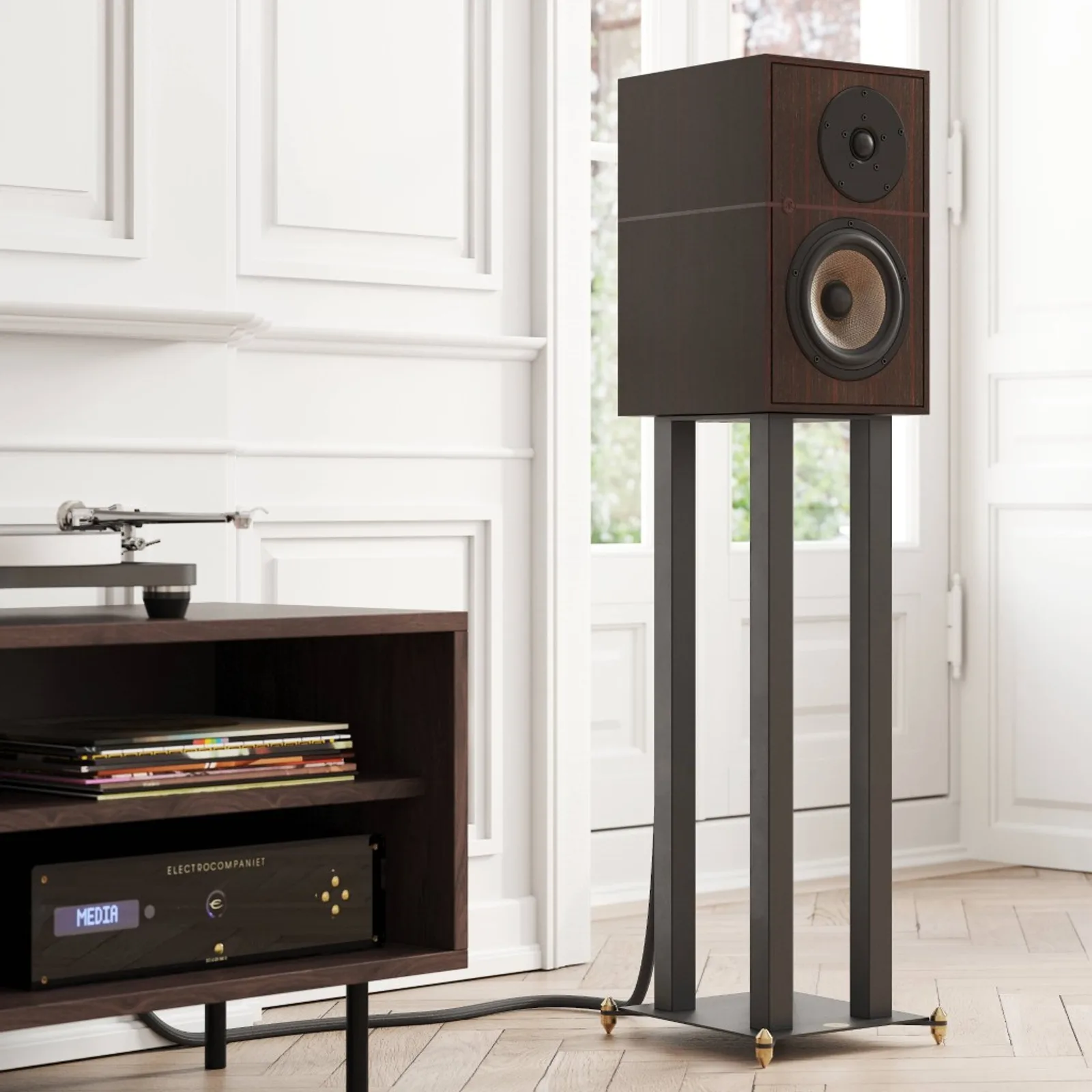 Loa Revival Audio ATALANTE 3 màu Ebony trên chân loa spike vàng cạnh kệ đĩa than sàn gỗ xương cá