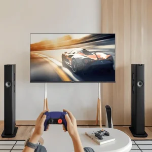 Cặp loa KEF LS60 Wireless Carbon Black trong phòng khách gaming với TV và PlayStation