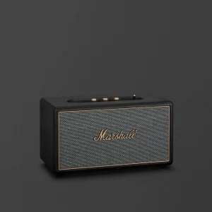 Loa Marshall Stanmore IV màu đen với lưới vải xám và logo vàng đồng trên nền tối