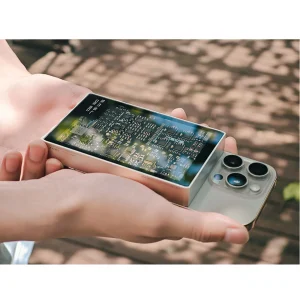 Tay cầm SMSL DS20 cạnh iPhone để so sánh kích thước, mặt trên trong suốt lộ mạch