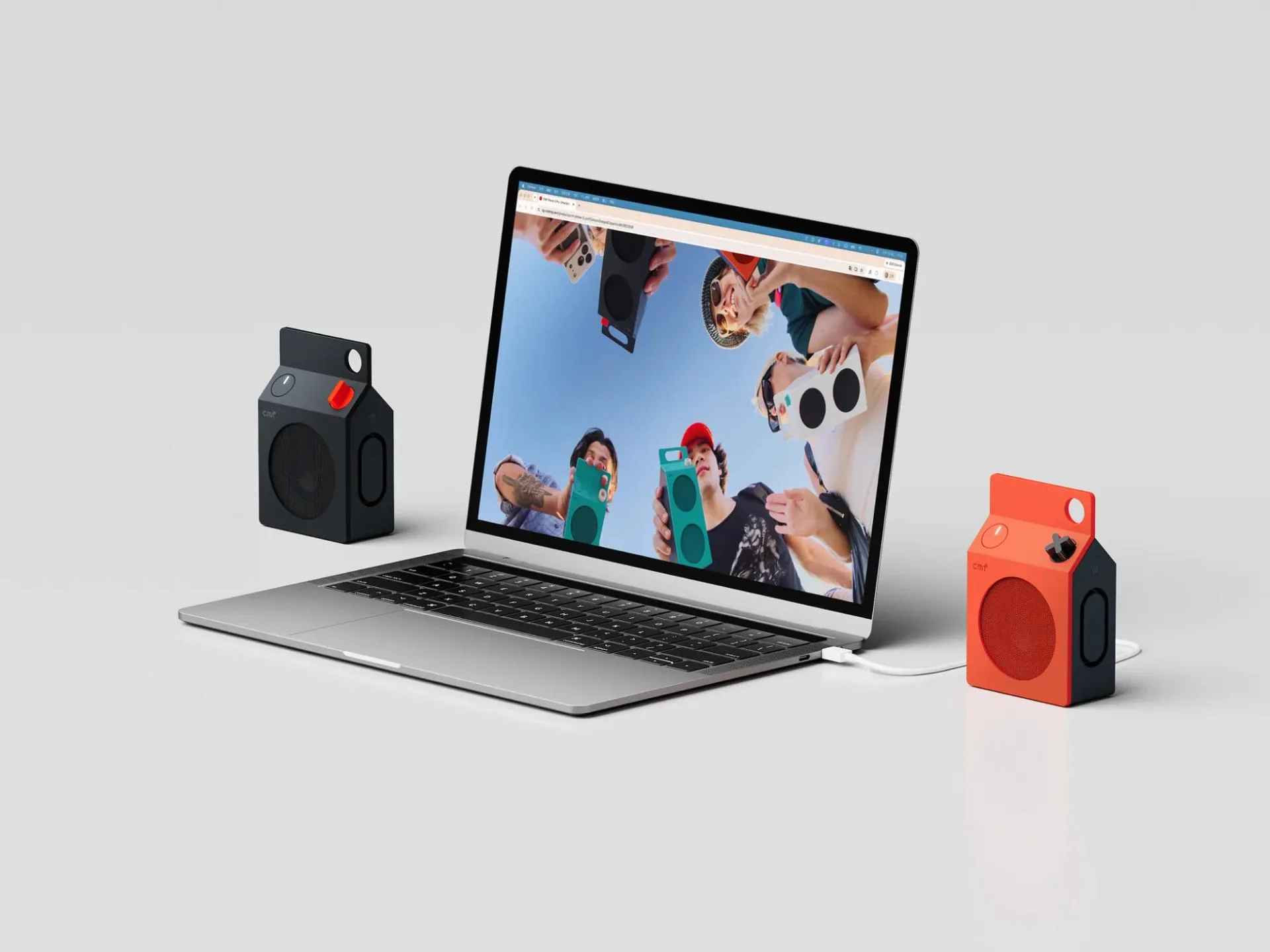 CMF Speaker M đen và cam cạnh laptop USB-C District M